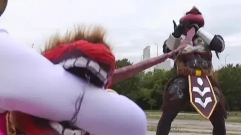 Asian Girl Fights with Muscular Man Outdoors