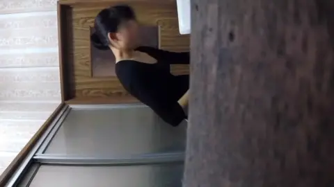Asian Girl Washing Face in Bathroom