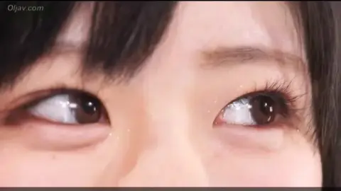 Asian Wrestlers in Red Sports Bras Engage in Intimate Match