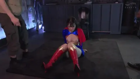 Asian Superwoman Bondage Scene