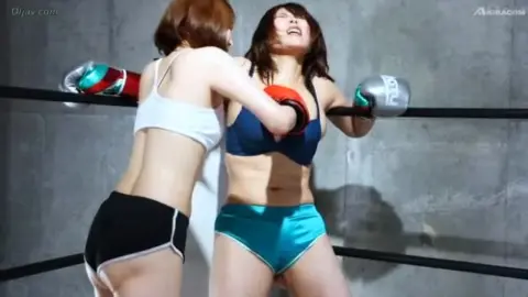 Asian Women Engage in Boxing Match