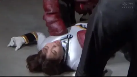 Costumed Performers Engage in Dramatic Scenes