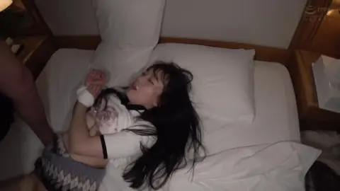 Asian Couple Intimate Moments in Bedroom