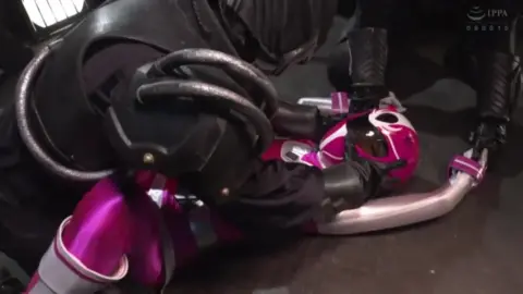 Asian Couple in Costume Intimate Encounter in Dark Room