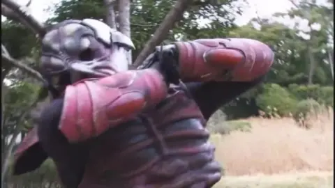 Asian Duo in Costume Pose for Camera