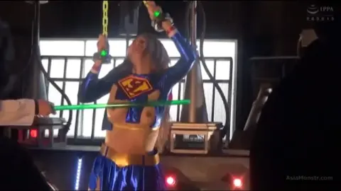 Asian Superman Girl Fights Robot in Warehouse