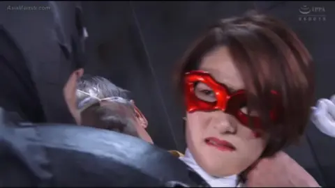 Asian Performers in Costumes on Stage