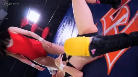 Asian Lesbians Wrestling in Sports Attire