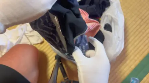 Asian Woman Handling Objects