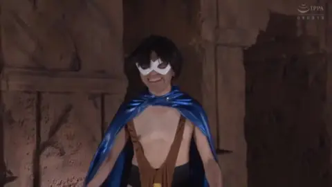 Asian Performers in Masks and Costumes