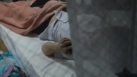 Asian Teen Uses Phone in Bedroom