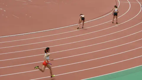 Asian Athletes in Sports Uniforms