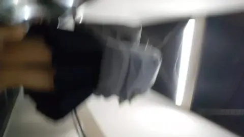 Asian Girl in Black Clothing at Airport Security