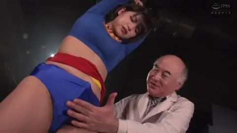 Asian Superhero Captured and Restraint