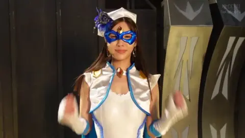 Asian Cosplay Duo in Costume Fantasy Scene