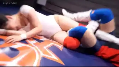 Asian Women Wrestling in Red Attire