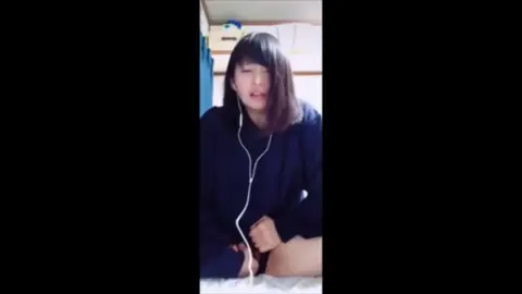 Asian Teen with Dark Hair and Bangs