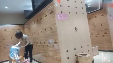 Asian Girl Changing Clothes in Locker Room