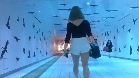 Blonde and Brunette in White Shorts and Black Top