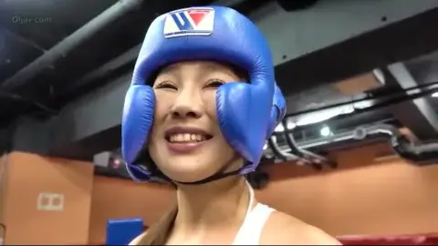 Asian Women Engage in Boxing Match