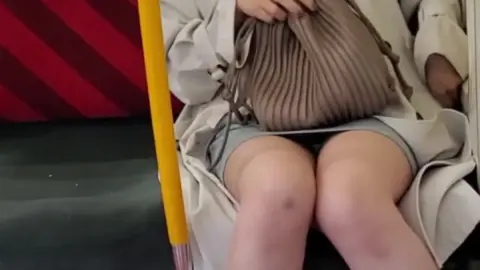 Asian Girl with Face Mask on Subway Train