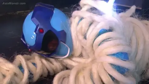 Asian Costumed Performers in Bondage and Fantasy Scenes