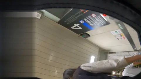 Asian Girl in Subway Station POV