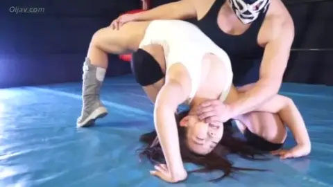 Asian Lesbians Wrestling on Blue Sheet