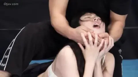 Asian Couple Wrestling and Choking in Ring