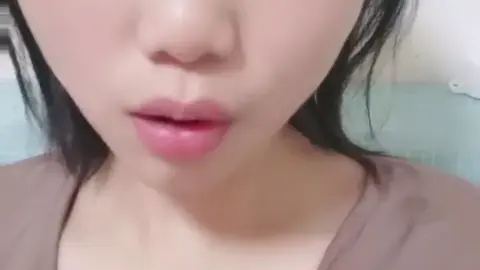 Asian Teen with Tongue Piercing in Intimate Bedroom Moments
