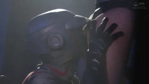 Asian Couple in Bondage Scene with Multiple Partners