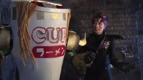 Asian Performers in Dramatic Scenes with Guns and Costumes