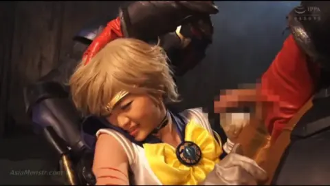 Blonde Cosplay Couple in Dark Intimate Encounter