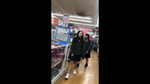 Asian Schoolgirls in Uniform Browsing Store