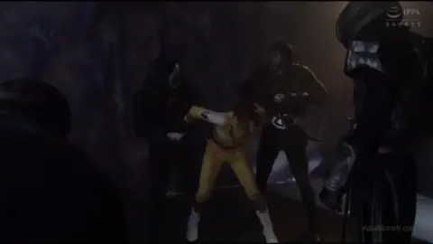 Girl in Bikinis Fights Black Costumed Figures