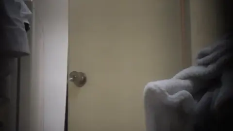 Asian Teen Undresses in Dimly Lit Bedroom