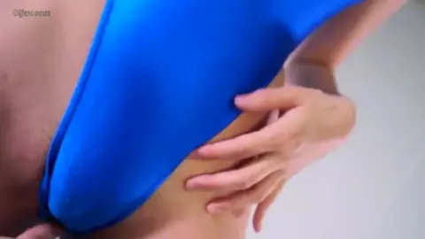 Asian Couple Intimate Moments on Blue Mat