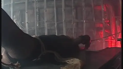 Tied Up Performers in Erotic Scene