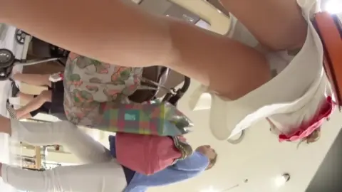 Girls Trying On Outfits in Clothing Store