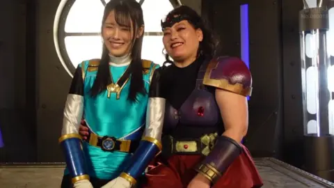 Asian Lesbians in Industrial Outfit Embrace