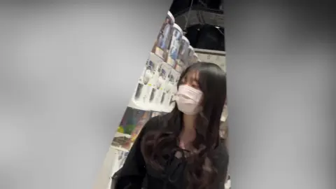 Asian Woman in Store