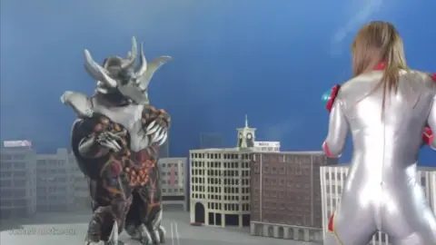 Blonde Asian Woman in Costume Fights Monster