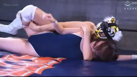 Asian Couple Wrestle and Make Love on Indoor Mat