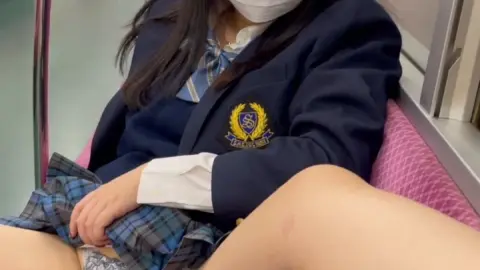 Asian Schoolgirl Exposes Herself on Train