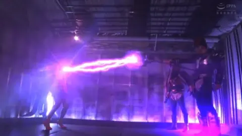 Asian Couple in Orange Dress – Intense Indoor Encounter