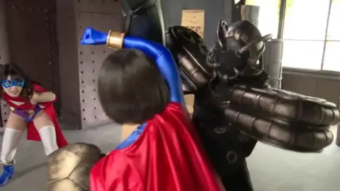 Asian Superheroes vs Robots and Construction Workers