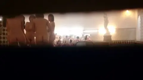 Girls Socializing in Public Bath