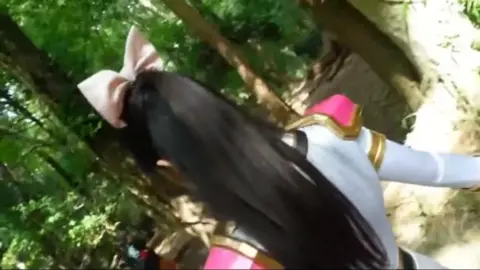 Asian Girl with Cat Ears in Forest and Cage