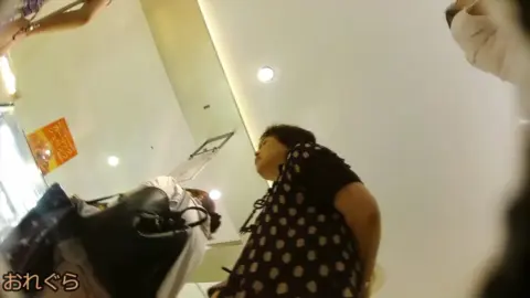 Asian Teen in Skirt and Dress Bends Over