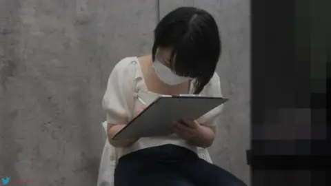 Asian Teen Undresses in Office